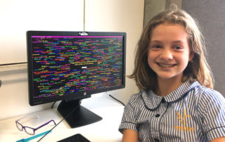 Amelie Kovse proudly smiling after she mastered a cognitive exercise as part of the Arrowsmith Program at Sydney Catholic Schools